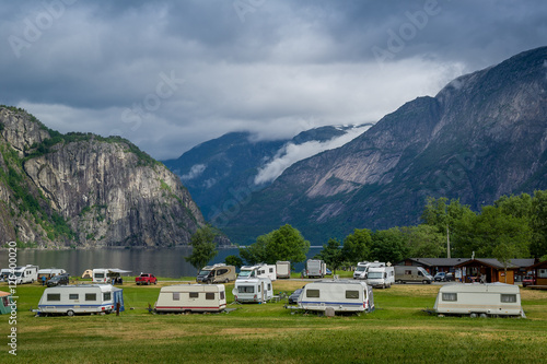 Camping at north sea fjord with mountains background, Norway.