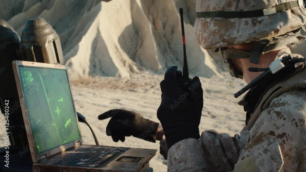 Interigator Computer Army Soldier is Using Laptop Computer for Tracking the Target and Radio for ...