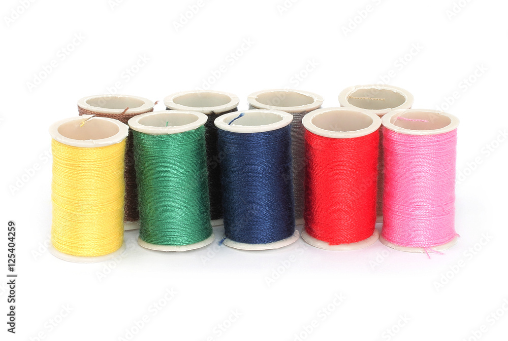 Color bobbins of thread on white background Color bobbins of thread on white background