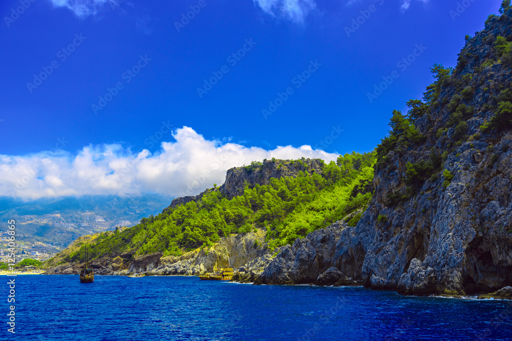 Fototapeta premium Rocky seashore with ships