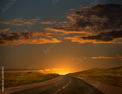 sunset over the country highway