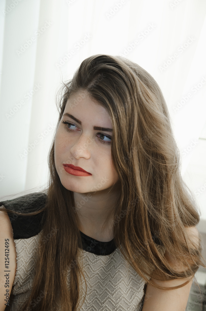 portrait of a beautiful girl with long brown hair close-up portrait of a beautiful girl with long brown hair close-up