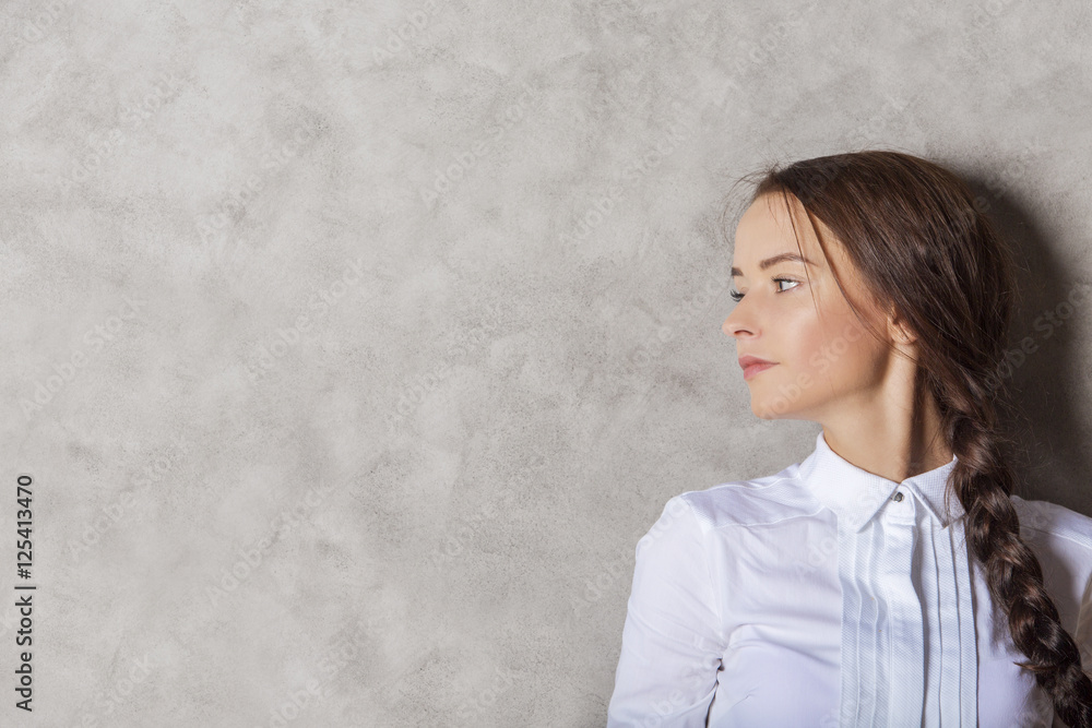 Attractive businesslady on concrete background Attractive businesslady on concrete background