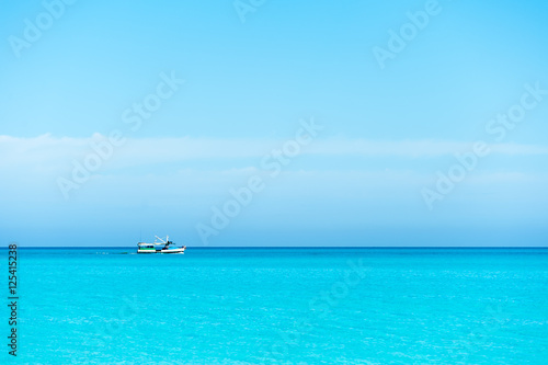 Boat sailing on blue Caribbean sea