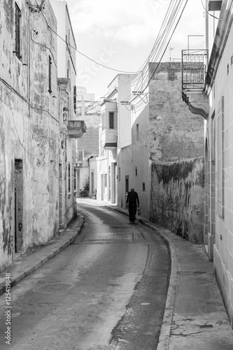 Lone Man Walking on a Street in Malta