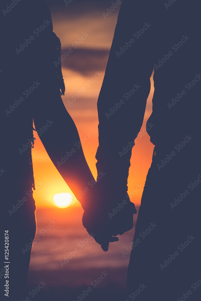 Couple Holding Hands Sunset