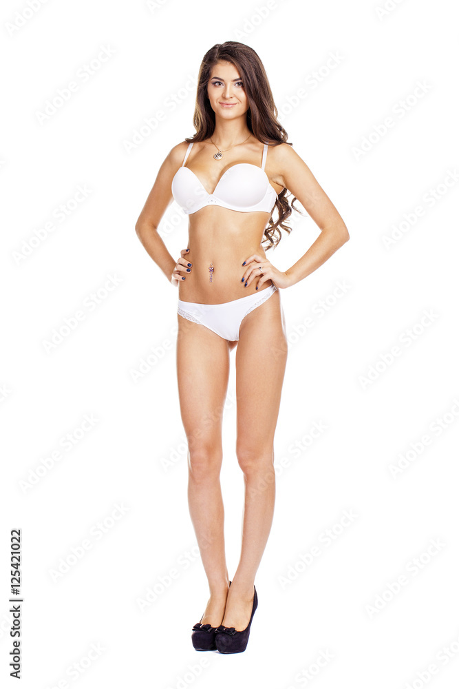Full length beautiful slim tanned woman in bikini, isolated on w Full length beautiful slim tanned woman in bikini, isolated on w