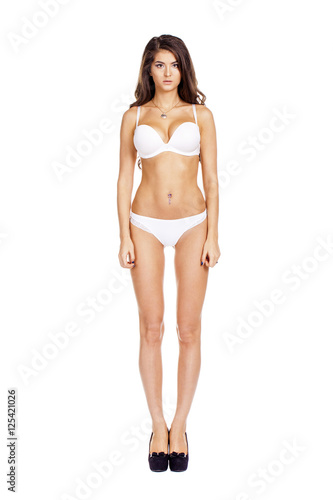 Full length beautiful slim tanned woman in bikini, isolated on w © Andrey_Arkusha