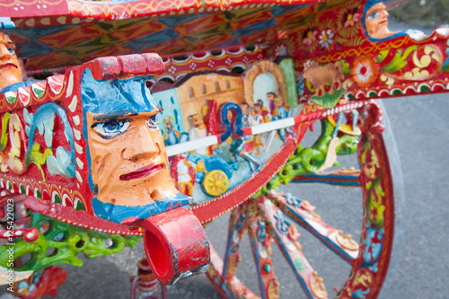 Closeup view of a colorful detail of a typical sicilian cart © siculodoc