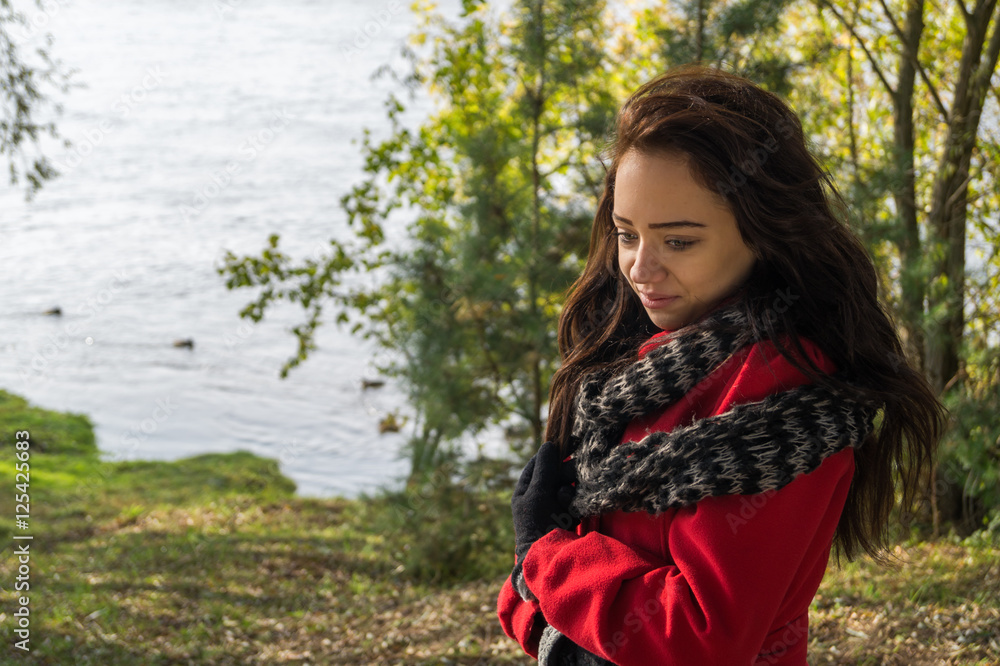 Portrait of beautiful woman with dark hair wearing elegant red c Portrait of beautiful woman with dark hair wearing elegant red c