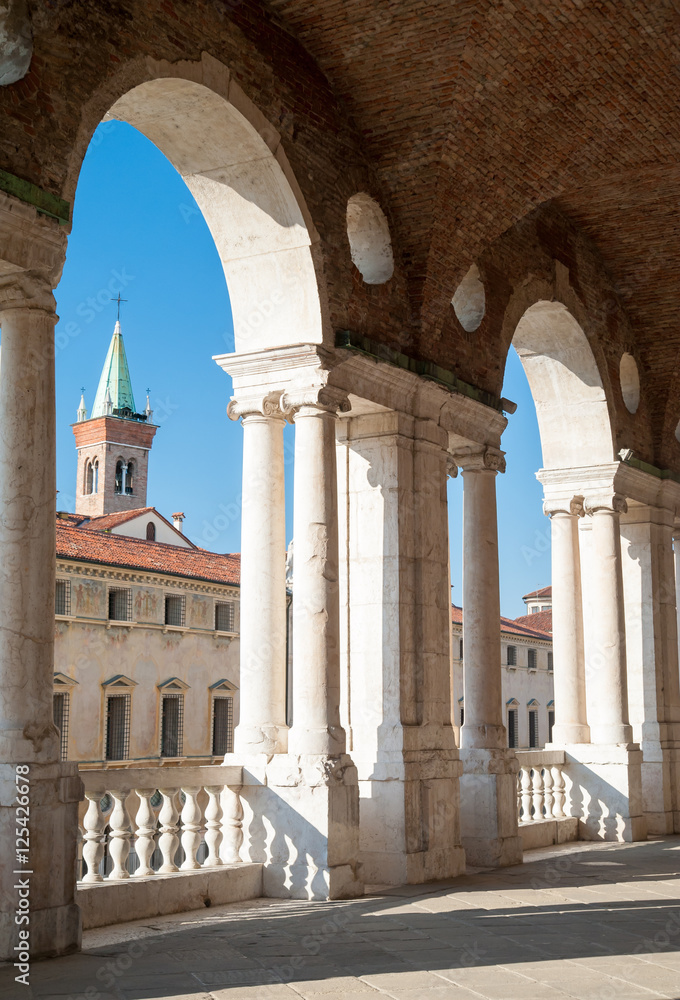Partial view of the Palladian basilica in Vicenza with a view of the facing St Vincenzo church in the background