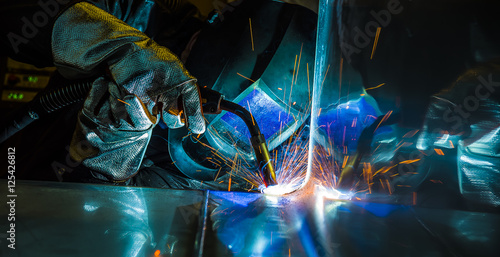 Фотография Industrial steel welder in factory