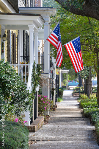 American Flags Flying on Town Sidewalk