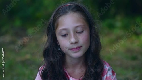 Little girl with a defiant look.