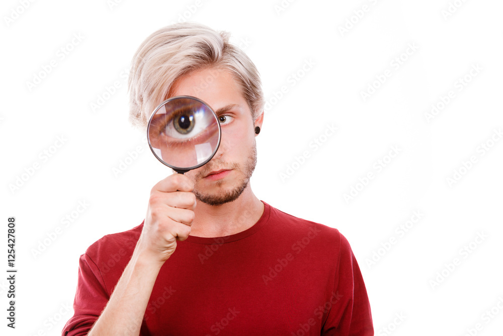 man holds on eye magnifying glass looking through loupe man holds on eye magnifying glass looking through loupe