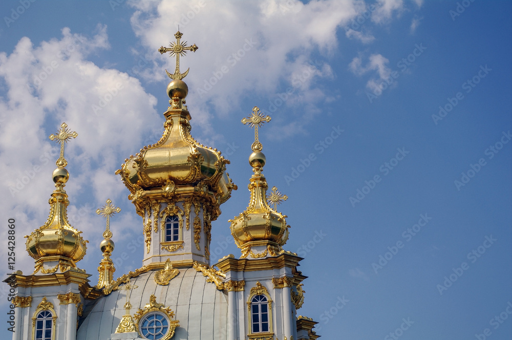 PETERHOF, SAINT PETERSBURG, RUSSIA - JUNE 06, 2014: top of tha church. the Upper Park palace was included in the UNESCO World Heritage List PETERHOF, SAINT PETERSBURG, RUSSIA - JUNE 06, 2014: top of tha church. the Upper Park palace was included in the UNESCO World Heritage List