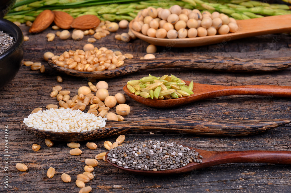Cereal grains , seeds, beans on wooden background. Cereal grains , seeds, beans on wooden background.