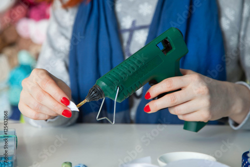 The woman is engaged in creative work in his workshop. photo