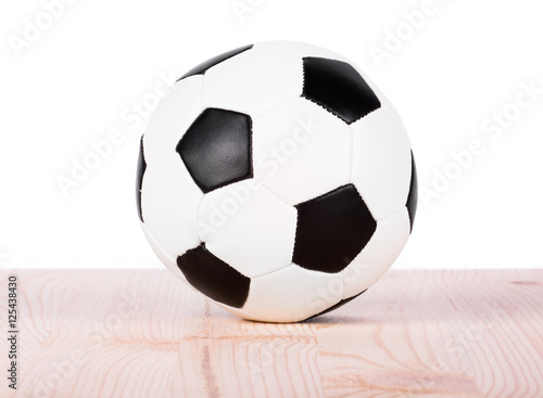 Soccer ball on wood shelf © arybickii