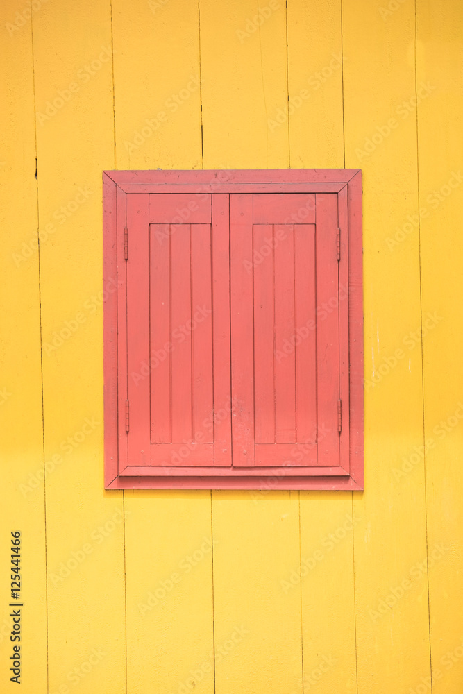 Red window and yellow wall, asian style Red window and yellow wall, asian style