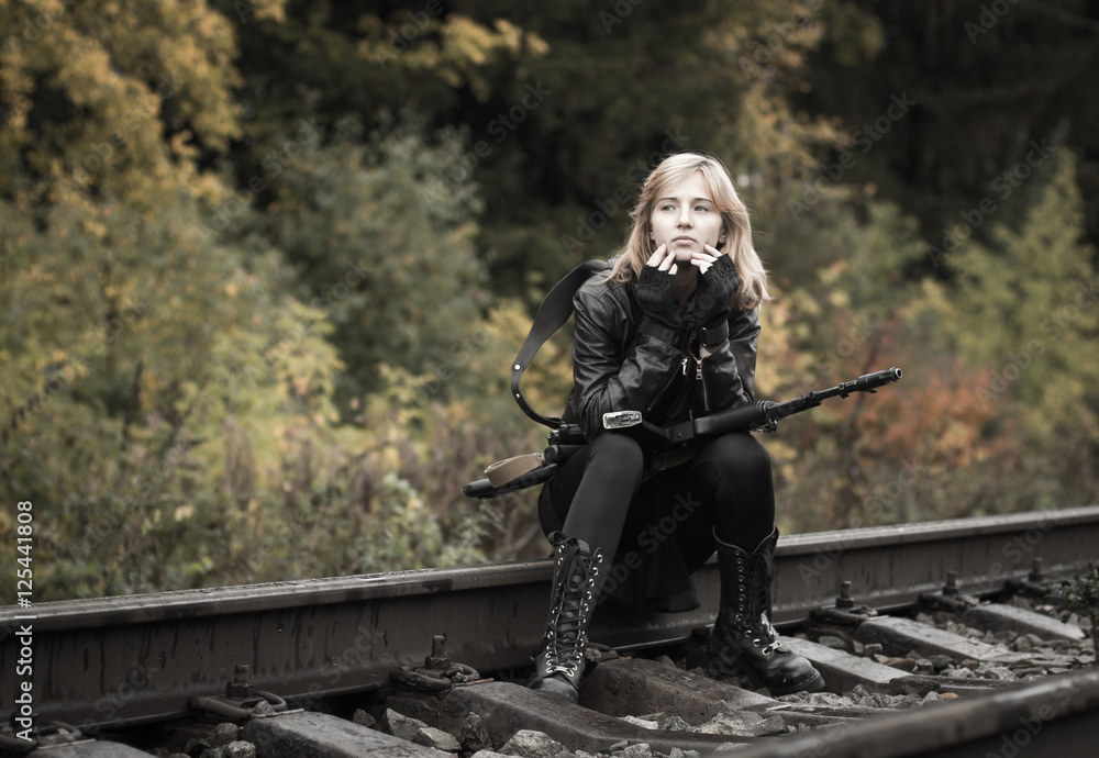 Girl with arms on the rails in autumn day Girl with arms on the rails in autumn day