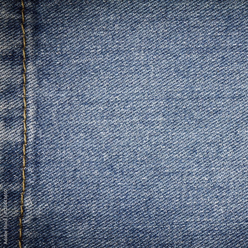 Denim jeans texture or denim jeans background with seam. Old grunge vintage denim jeans. Stitched texture denim jeans background of fashion jeans design. Denim jeans texture or denim jeans background with seam. Old grunge vintage denim jeans. Stitched texture denim jeans background of fashion jeans design.