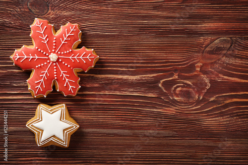 Tasty Christmas cookies on wooden table