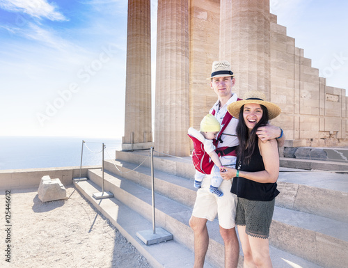 young beautiful couple traveling with a baby, In Greece