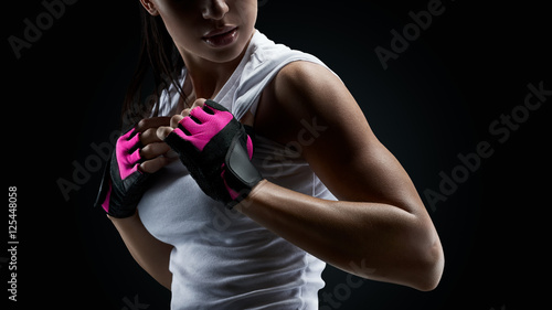 Female athlete on black background © USM Photography