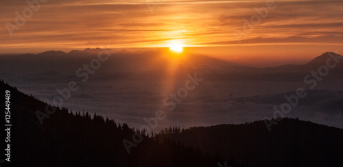 sunrise above Tatras mountain range from Chata pod Chlebom chalet in autumn Mala Fatra mountains in Slovakia