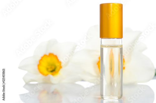  perfume bottle with flowers isolated on white