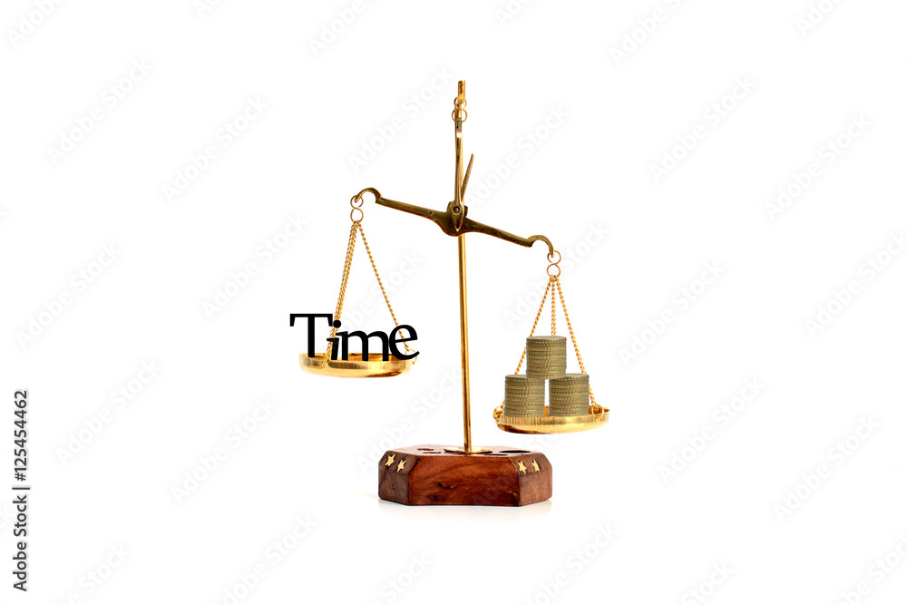 Time is money concept with time symbol and coins in a brass balance Time is money concept with time symbol and coins in a brass balance