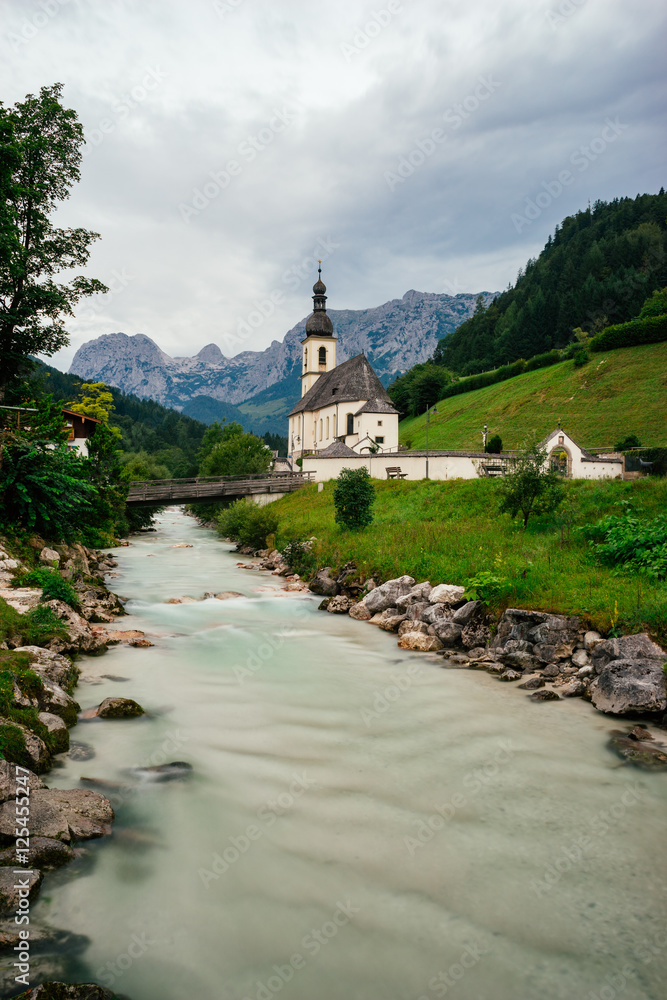 The Church of St. Sebastian against alpine mountains, Germany