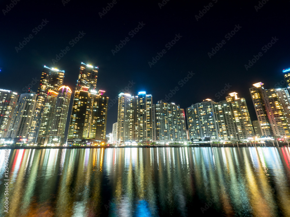 Night view of several buildings over the city's marine harbor in Busan Night view of several buildings over the city's marine harbor in Busan