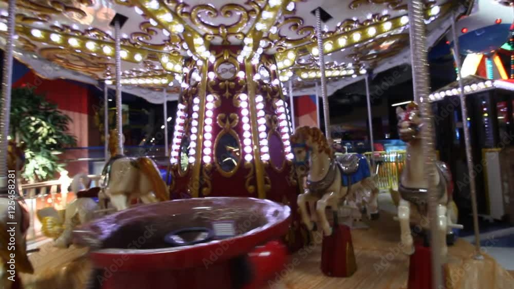 Mom with children in the amusement park, blur in the frame. Mom with children in the amusement park, blur in the frame.
