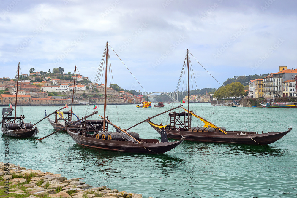 Douro river rabelos boat detail Porto Oporto wine barrel historic cityscape embankment