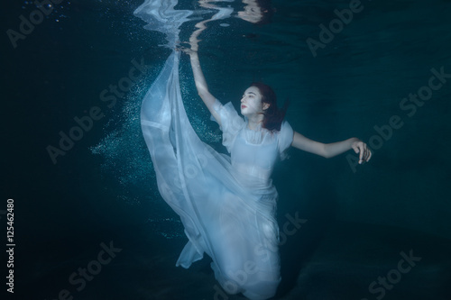 Woman on the ocean floor.