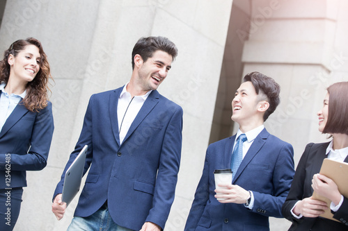 Photography businesspeople walk on road