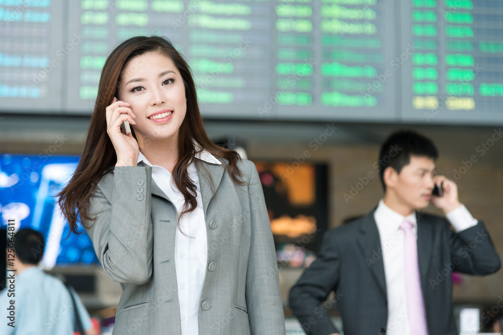 beautiful asian young girl calls in airport hall beautiful asian young girl calls in airport hall