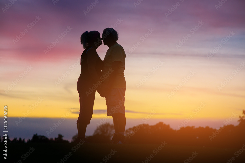 Couple standing on sky background. People touch noses. Save love and loyalty. Feels like heaven.