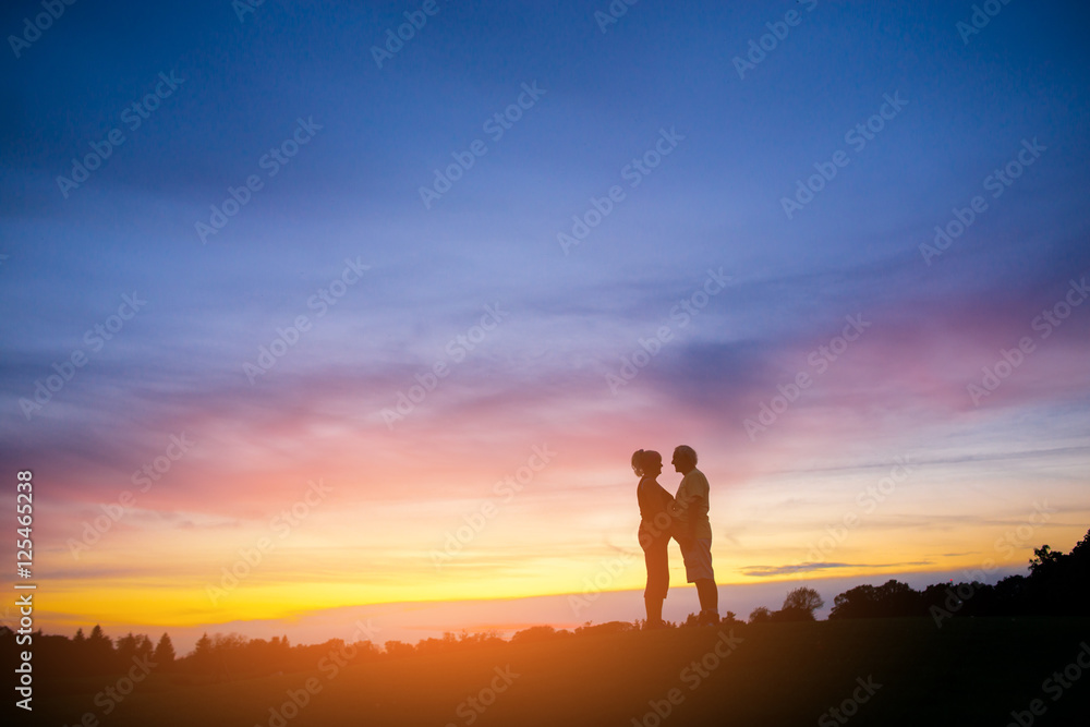 Couple standing on sunset background. Silhouettes of man and woman. Everything for you. Happiness of all life.