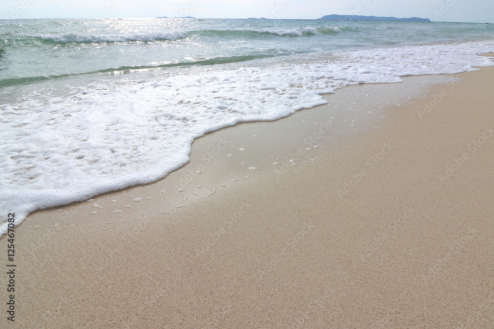 Wave of the sea on the sand beach background, Sea foam Wave of the sea on the sand beach background, Sea foam
