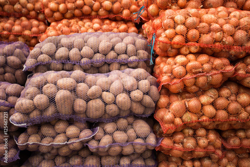 Bags with onion and potato at farmers market