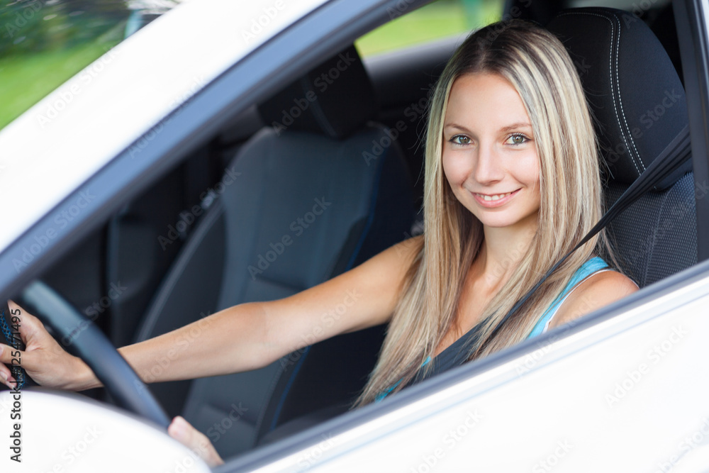 Young woman behind the steering wheel