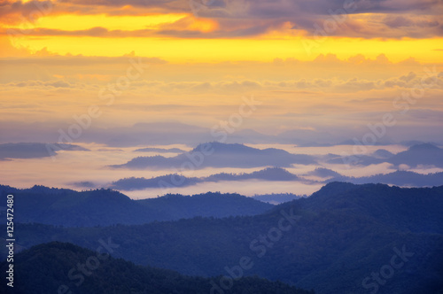 Foggy landscape, View on top mountains and winter morning fog.