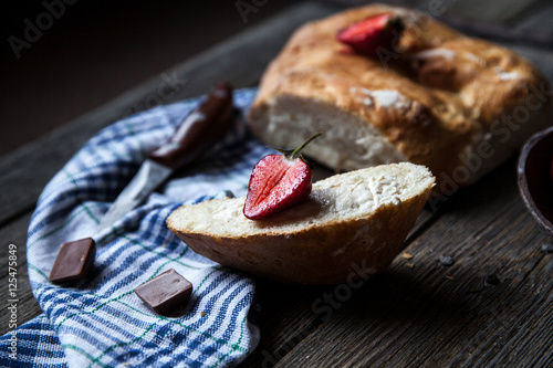 delicious breakfast with strawberries and bread on wooden background. Fruit, food