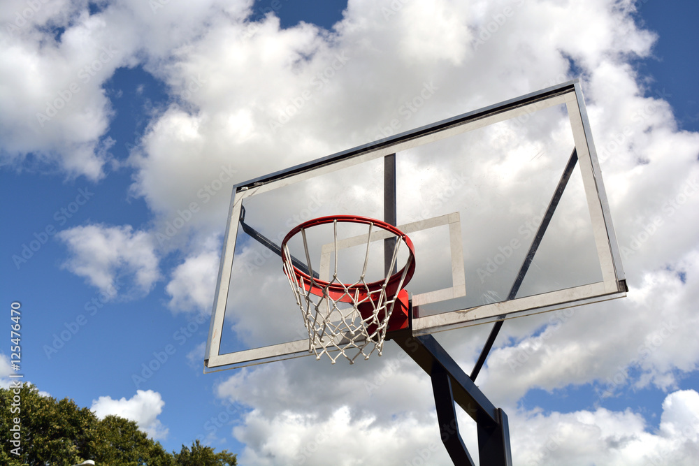 basketball backboard on blue cloudy sky background