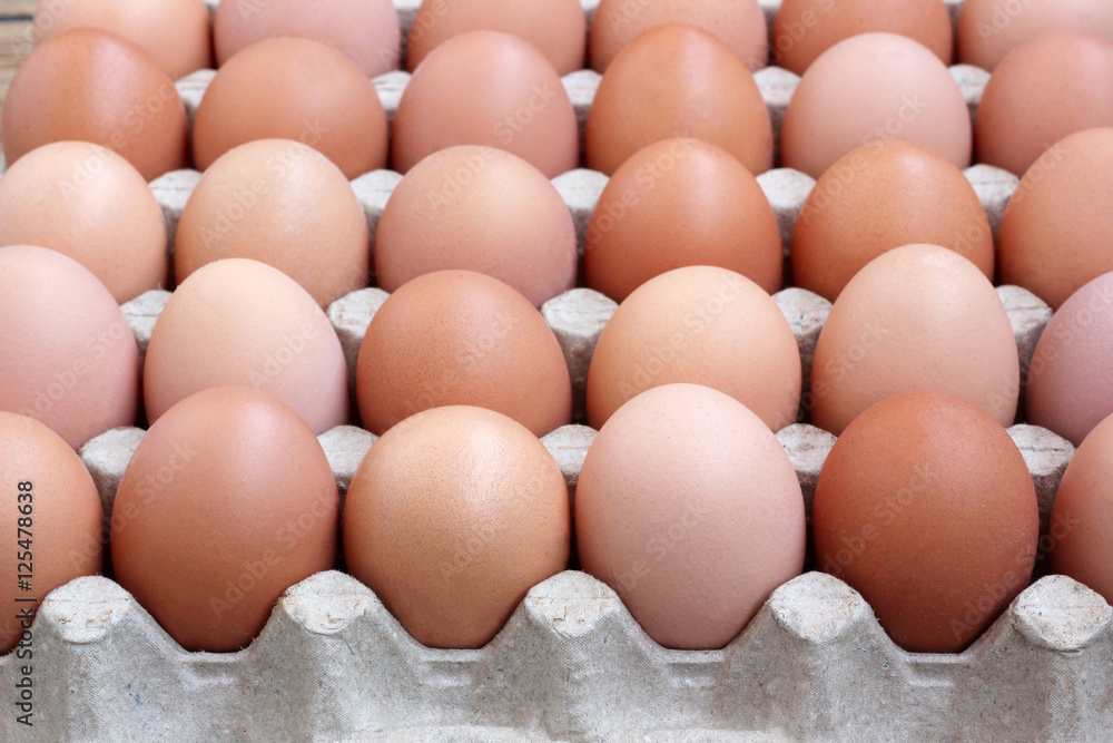 Chicken brown eggs in packing , the top view. Chicken brown eggs in packing , the top view.