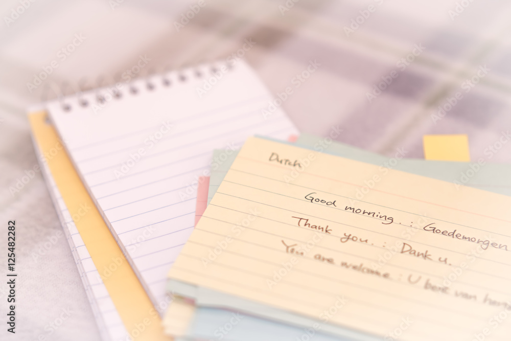Dutch; Learning New Language Writing Greetings on the Notebook Dutch; Learning New Language Writing Greetings on the Notebook