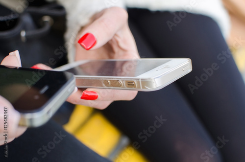 Young woman is using her cellphone 